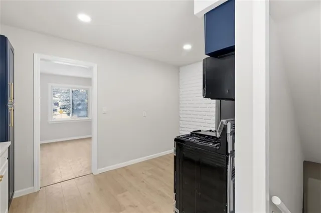 a kitchen with a sink and a stove top oven