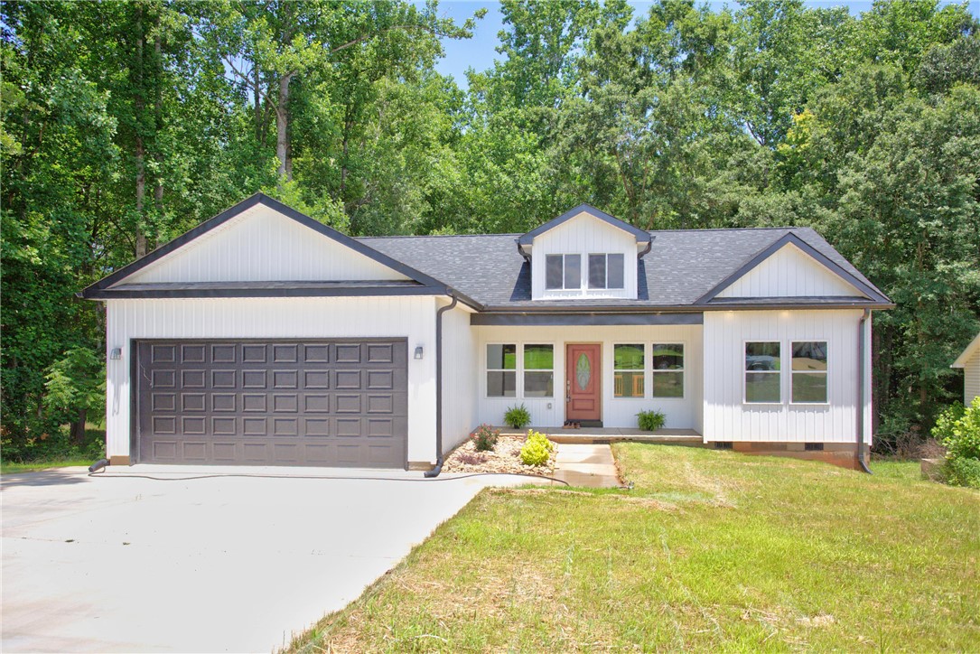 223 Maple Drive Anderson, SC 29621 - Photo 1 of 45 Modern façade with contrasting dark roof and trim offers compelling curb appeal.
