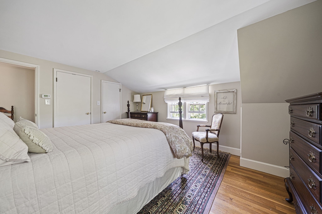 639 Main Street Hingham, MA 02043 - Photo 18 of 41 a bed room with a bed and a chair