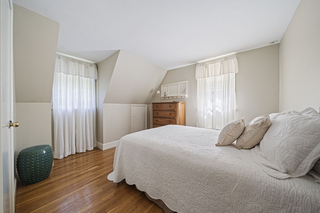 639 Main Street Hingham, MA 02043 - Photo 21 of 41 a bedroom with a bed and a window