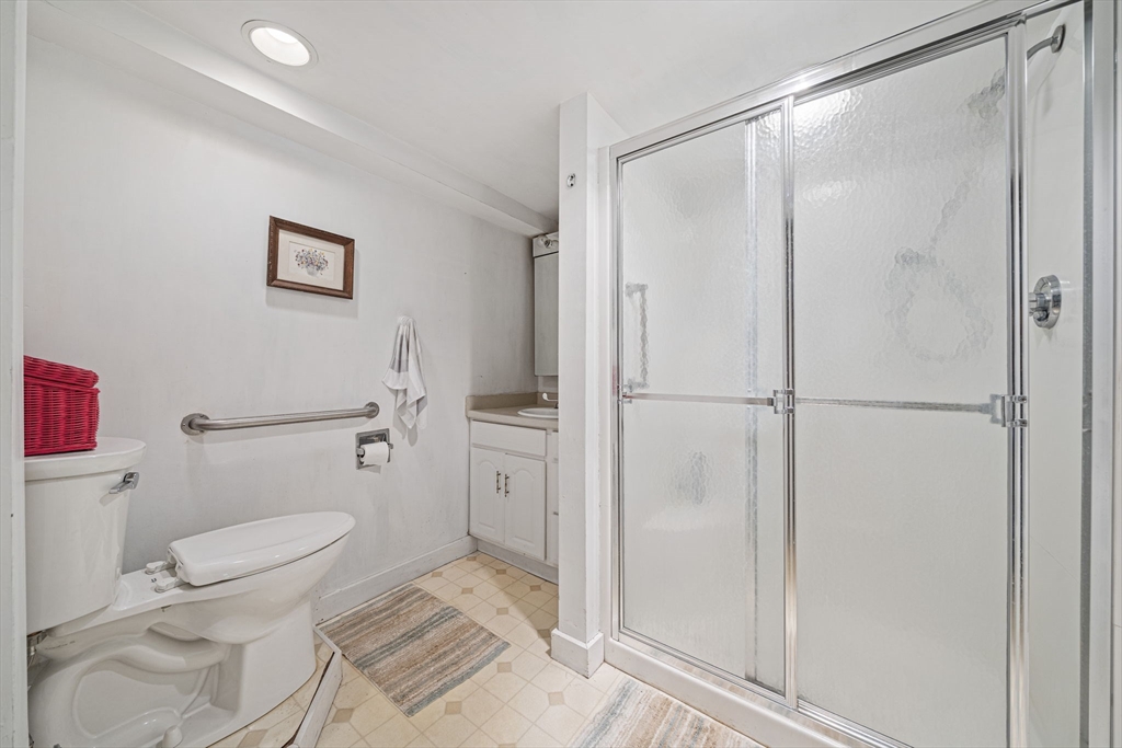639 Main Street Hingham, MA 02043 - Photo 22 of 41 a bathroom with a toilet and a shower