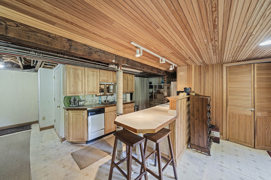 639 Main Street Hingham, MA 02043 - Photo 25 of 41 a kitchen with a table and chairs