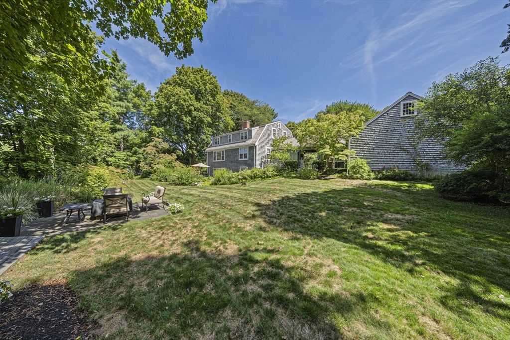639 Main Street Hingham, MA 02043 - Photo 26 of 41 a backyard of a house with lots of green space