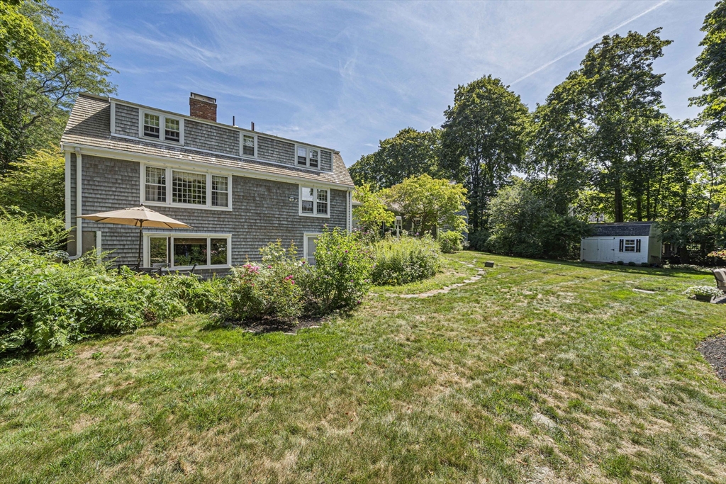 639 Main Street Hingham, MA 02043 - Photo 27 of 41 a front view of a house with a yard