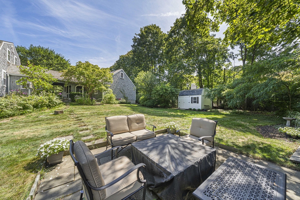 639 Main Street Hingham, MA 02043 - Photo 29 of 41 a view of yard with seating area and trees around