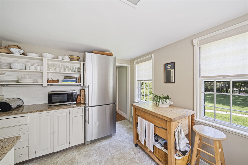 639 Main Street Hingham, MA 02043 - Photo 7 of 41 a kitchen with stainless steel appliances a refrigerator and a stove top oven