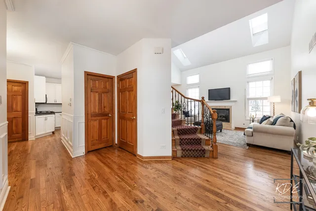 wooden floor in an empty room with a fireplace