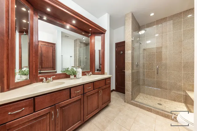 a bathroom with a shower a toilet and sink