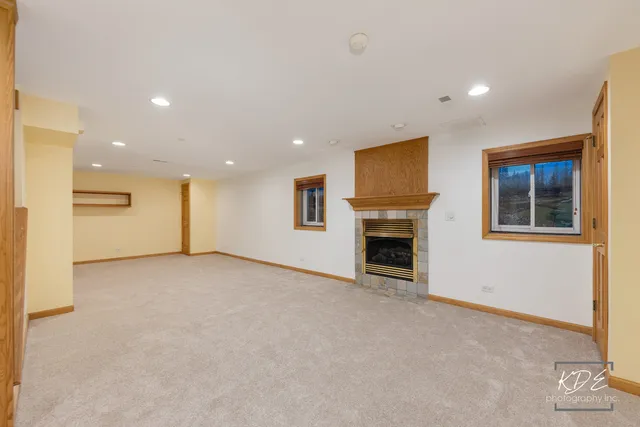 a view of an empty room with closet area