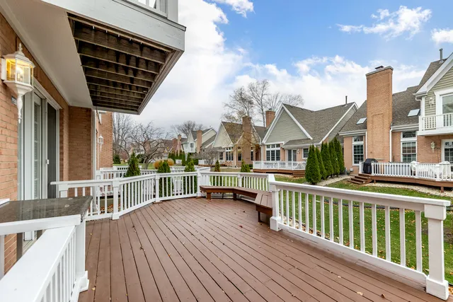 an aerial view of a house with outdoor space and lake view