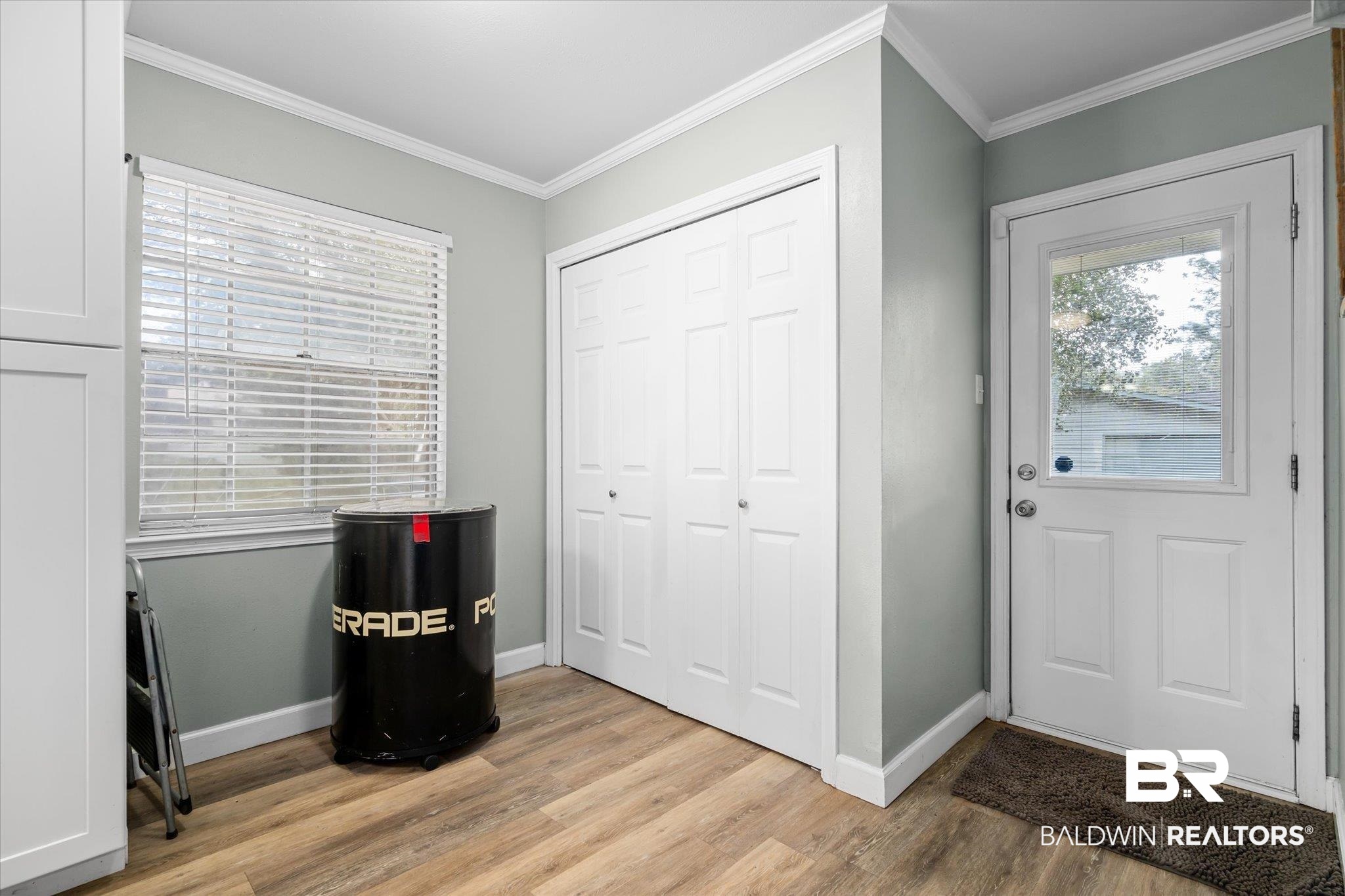 9987 Downing Street Semmes, AL 36575 - Photo 7 of 20 Entryway featuring ornamental molding and light wood-type flooring