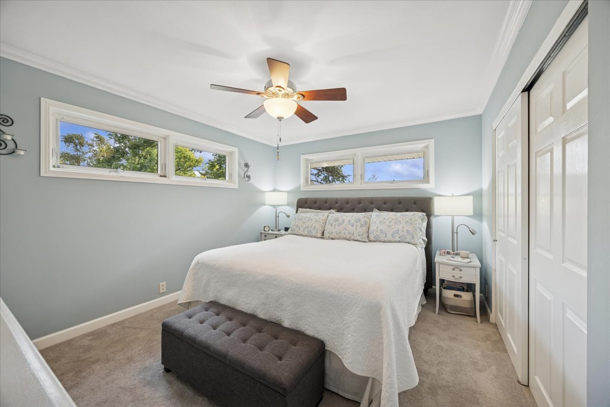 305 Poplar Lane New Lenox, IL 60451 - Photo 12 of 23 a bedroom with a bed and a painting on the wall