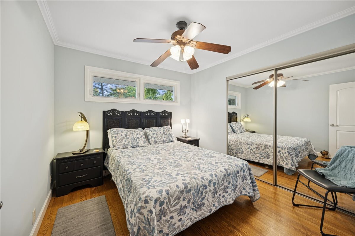 305 Poplar Lane New Lenox, IL 60451 - Photo 13 of 23 a bedroom with a bed and wooden floor