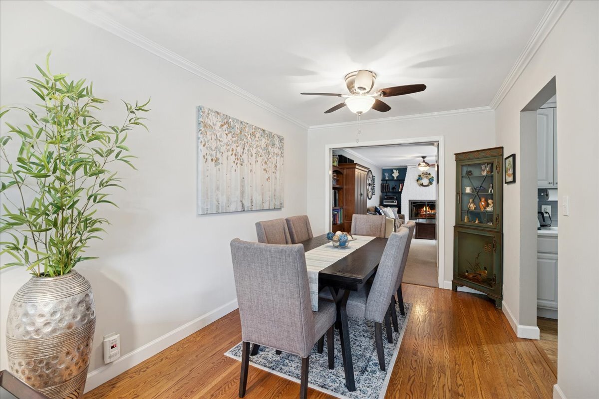 305 Poplar Lane New Lenox, IL 60451 - Photo 8 of 23 a view of a dining room with furniture and wooden floor