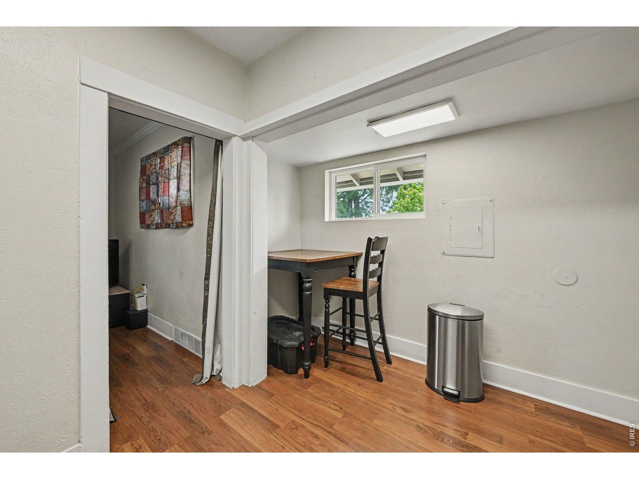 427 9th Street Greeley, CO 80631 - Photo 9 of 22 a dining room with furniture and a wooden floor