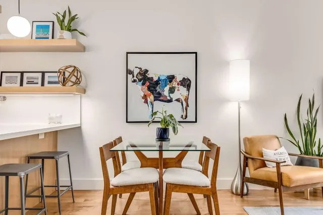 a bedroom with a bed and glass window