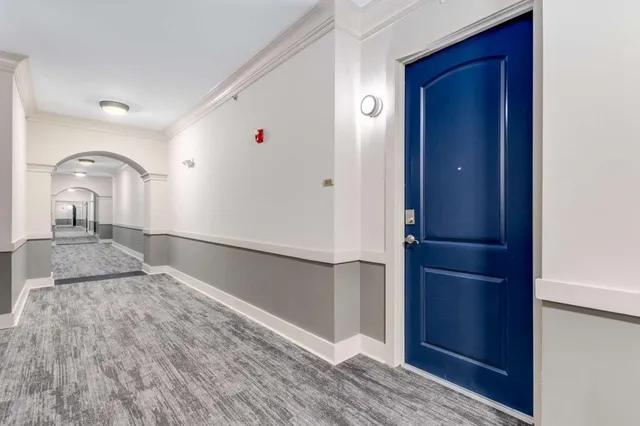 a kitchen with stainless steel appliances granite countertop a sink a stove and a wooden floors