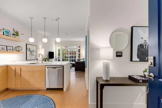 a kitchen with granite countertop a stove and a sink