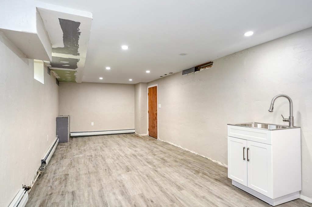 16 Lasallette Road, Unit 16 Billerica, MA 01821 - Photo 17 of 27 a view of an empty room with wooden floor