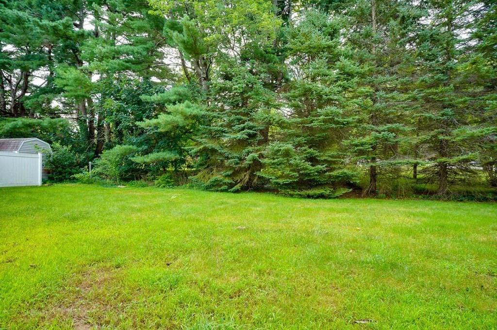16 Lasallette Road, Unit 16 Billerica, MA 01821 - Photo 23 of 27 a view of a field of grass and trees