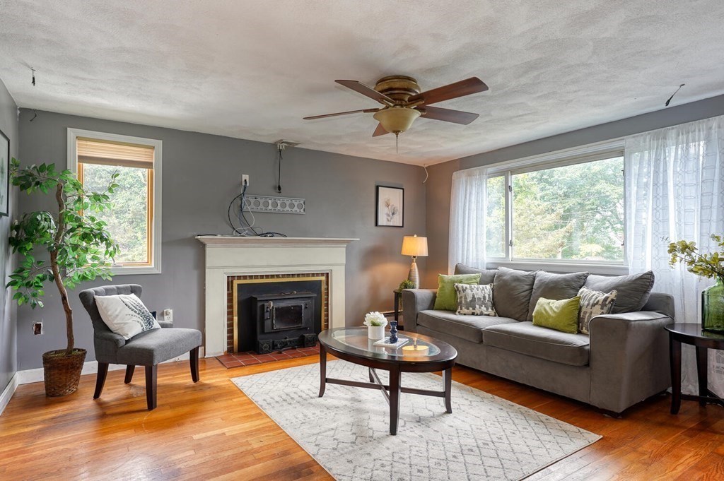 16 Lasallette Road, Unit 16 Billerica, MA 01821 - Photo 3 of 27 a living room with furniture and a fireplace
