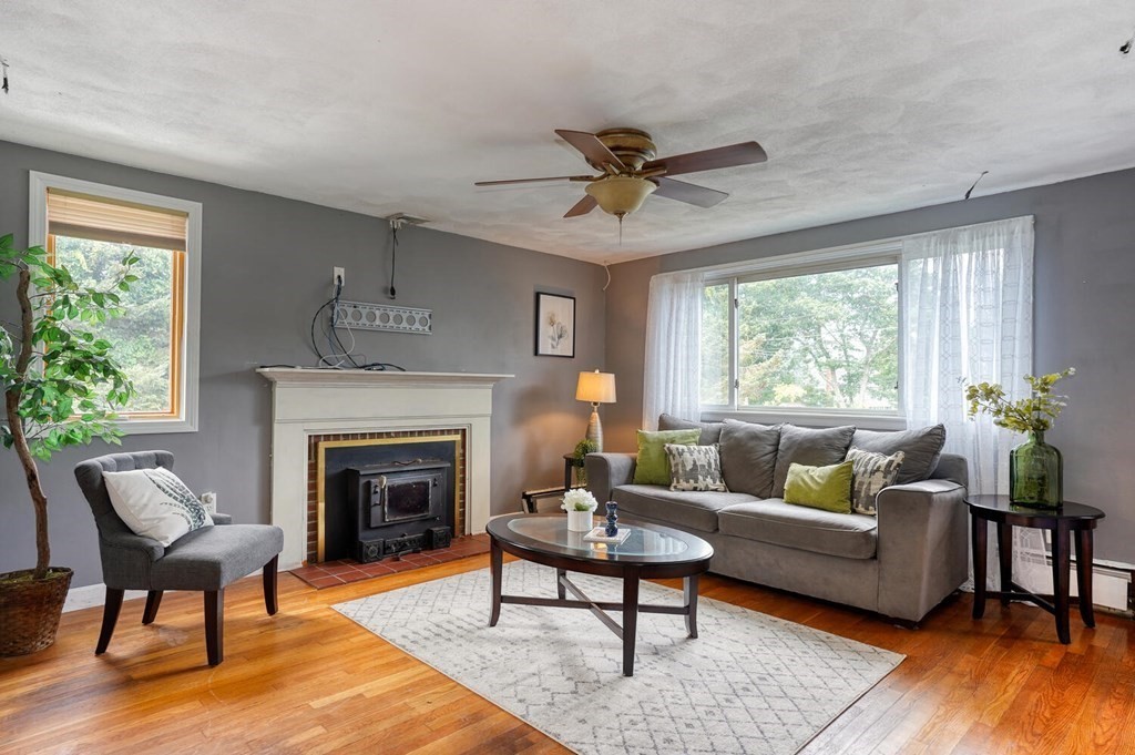16 Lasallette Road, Unit 16 Billerica, MA 01821 - Photo 4 of 27 a living room with furniture and a fireplace