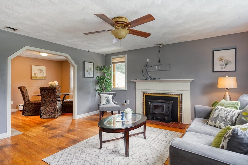 16 Lasallette Road, Unit 16 Billerica, MA 01821 - Photo 5 of 27 a living room with furniture and a fireplace