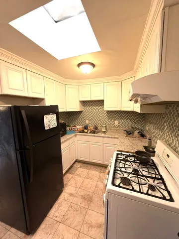 a room with furniture and air hockey table