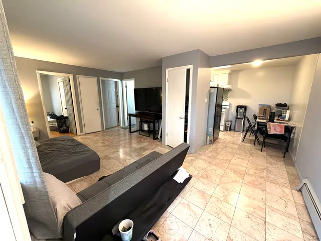 a kitchen with a sink a stove and refrigerator