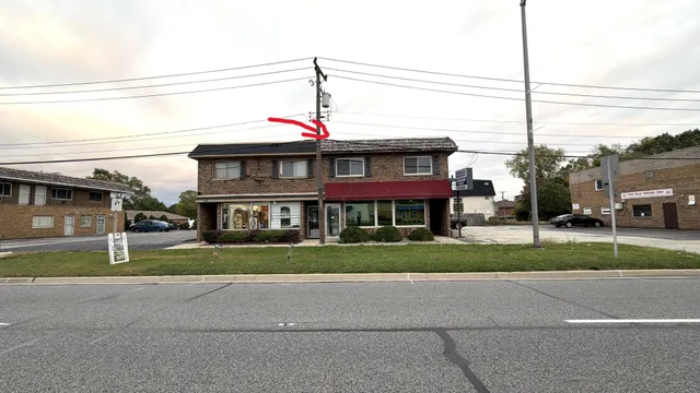 a view of a house next to a yard