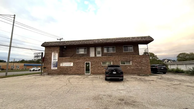 a view of a car parked in front of a house
