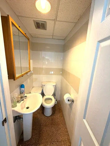 a view of a workspace with furniture