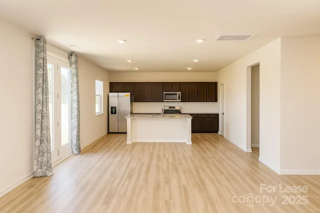 a view of kitchen with wooden floor