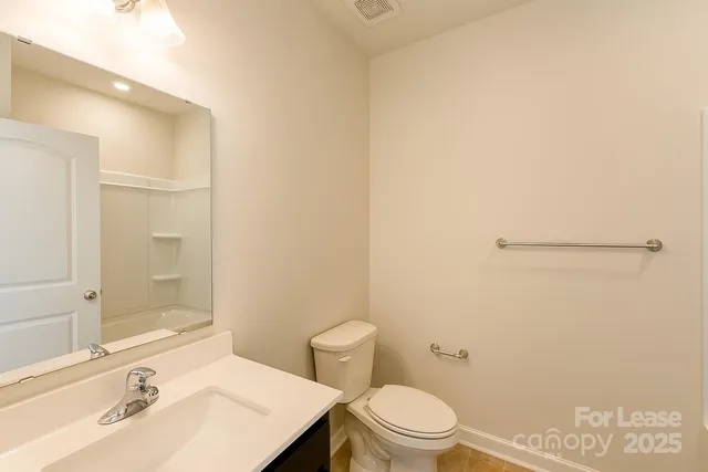 a view of a room with wooden floor and windows
