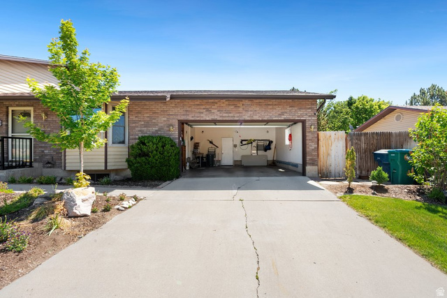 865 South 325 West Orem, UT 84058 - Photo 31 of 38 Extra long two-car garage with a concrete driveway