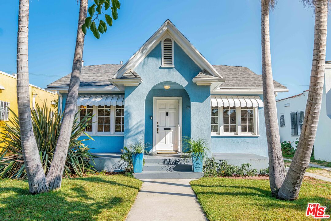 2832 Virginia Road Los Angeles, CA 90016 - Photo 1 of 14 a front view of a house with garden