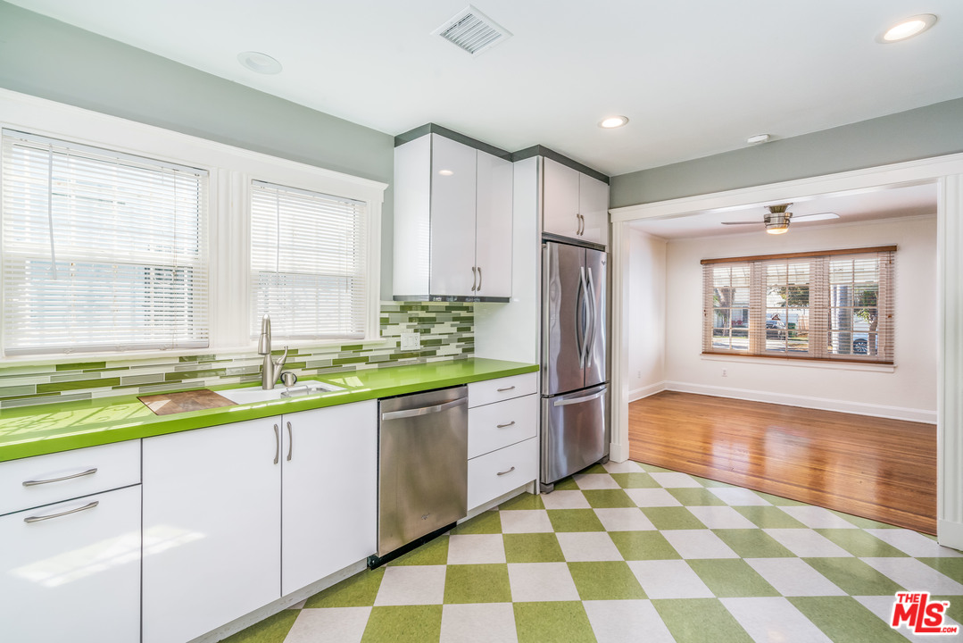 2832 Virginia Road Los Angeles, CA 90016 - Photo 5 of 14 a large kitchen with a stove a sink and a refrigerator