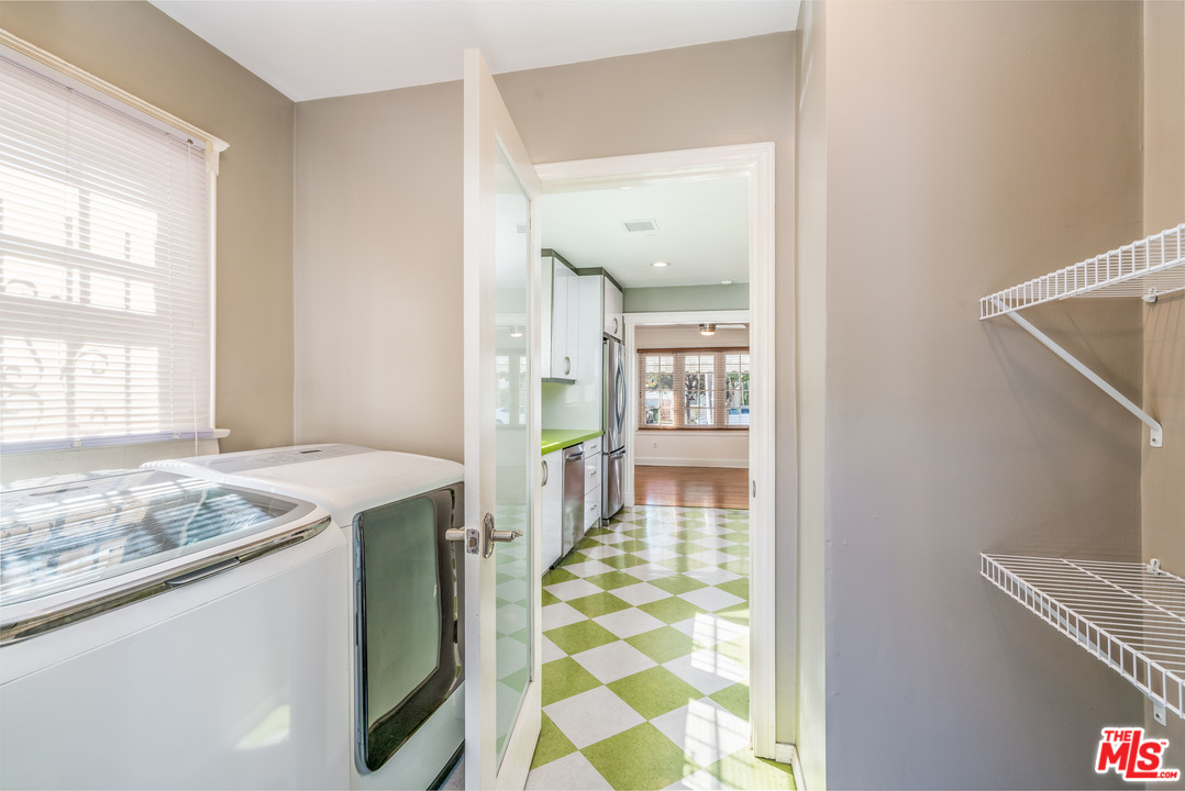 2832 Virginia Road Los Angeles, CA 90016 - Photo 8 of 14 a bathroom with a granite countertop sink and a mirror