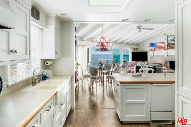 a kitchen with a stove and a sink