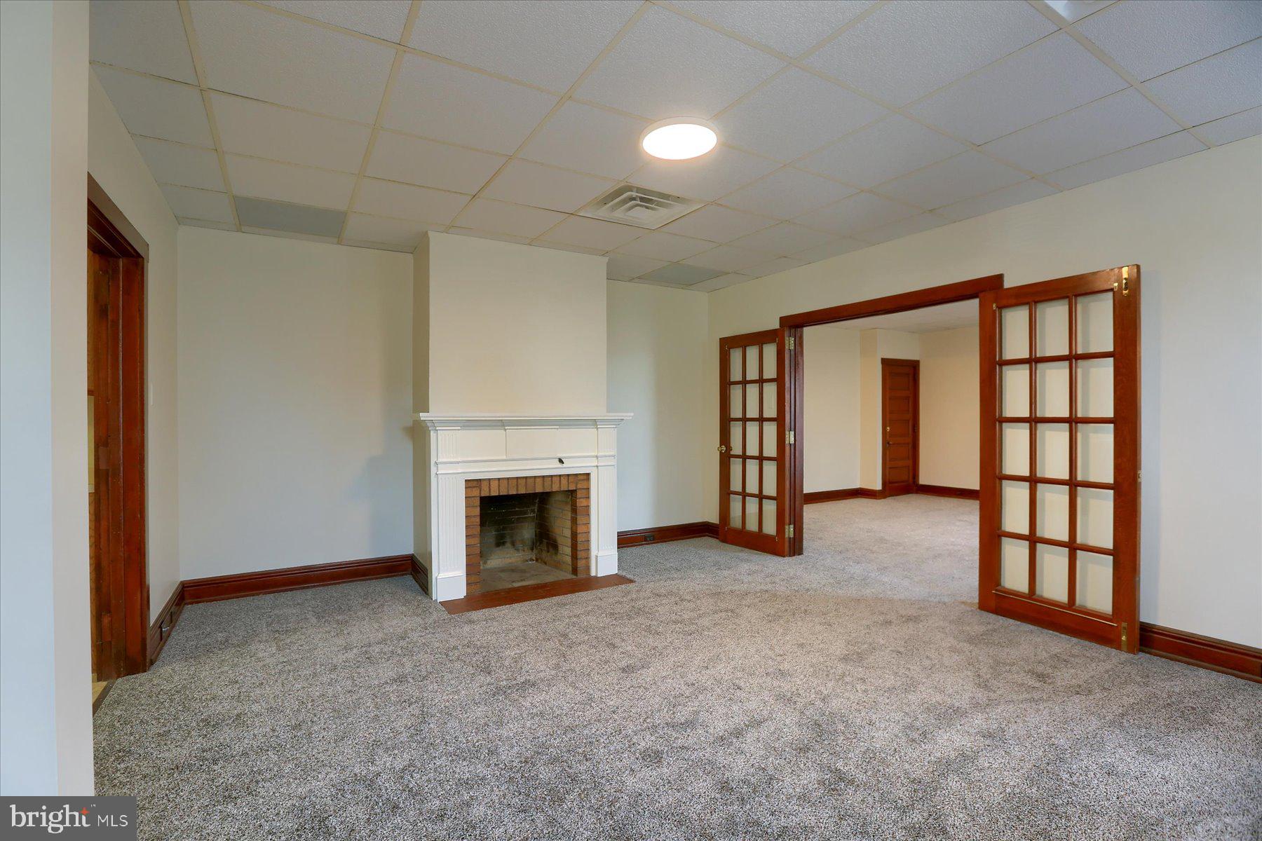 50 East Maple Street, Unit 4 Palmyra, PA 17078 - Photo 6 of 22 an empty room with windows and fireplace