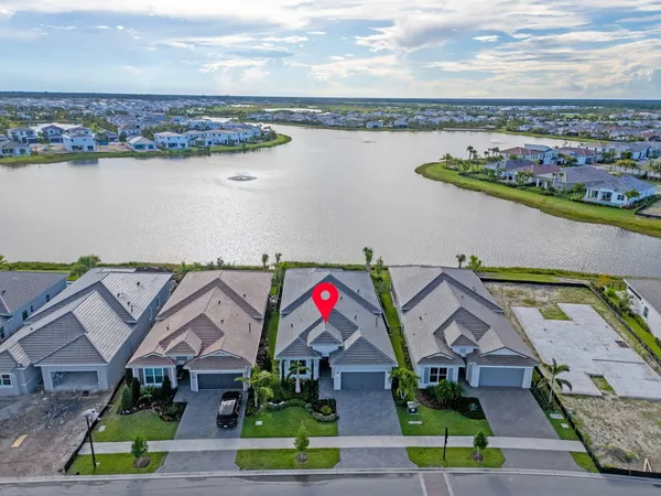 an aerial view of houses with yard
