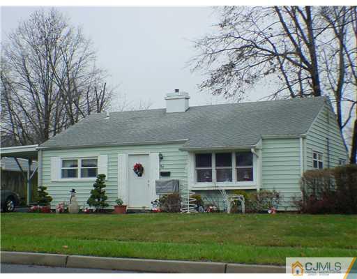 64 Stony Road Edison, NJ 08817 - Photo 2 of 2 a view of a white house with a yard