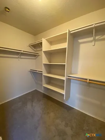 a view of an empty walk in closet