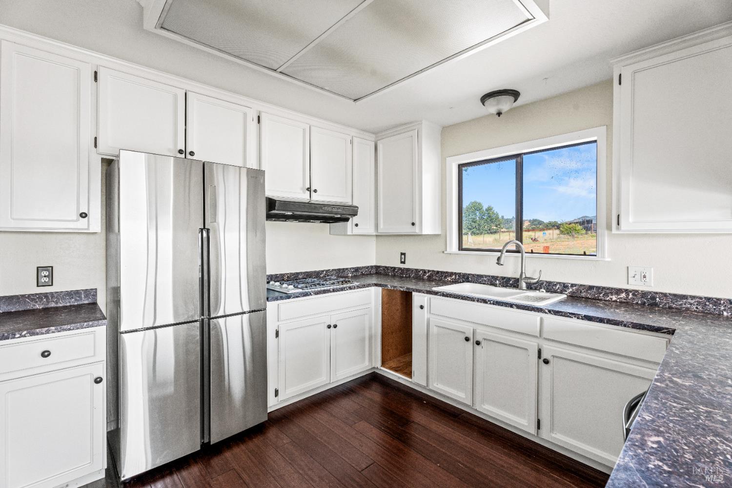 3850 Rd B Redwood Valley, CA 95470 - Photo 11 of 35 a kitchen with granite countertop stainless steel appliances a sink and cabinets