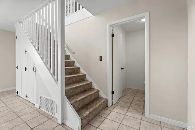 a view of a hallway with staircase