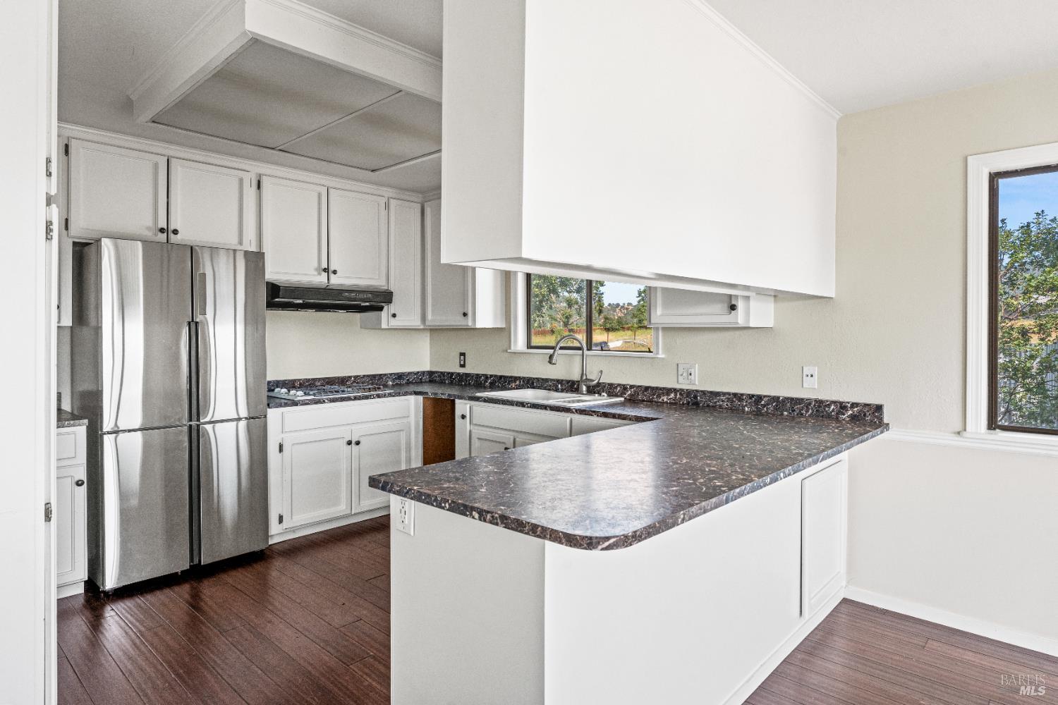 3850 Rd B Redwood Valley, CA 95470 - Photo 9 of 35 a kitchen with stainless steel appliances granite countertop a refrigerator a sink and a stove