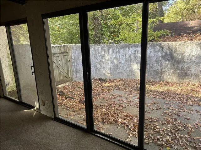 a view of a room with large windows