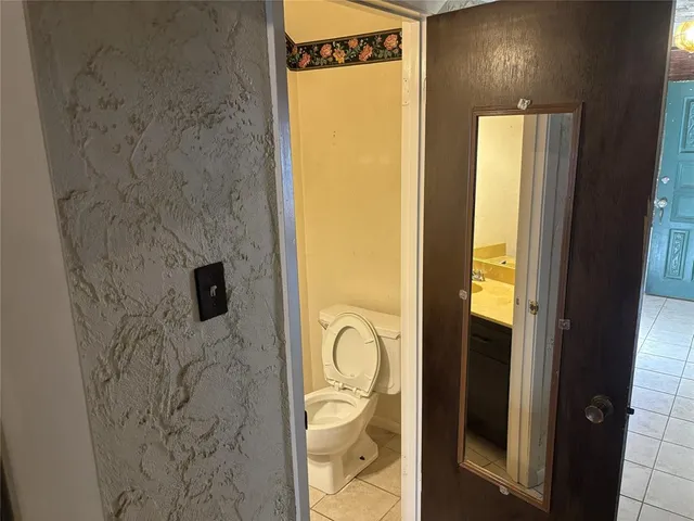 a bathroom with a shower and a mirror
