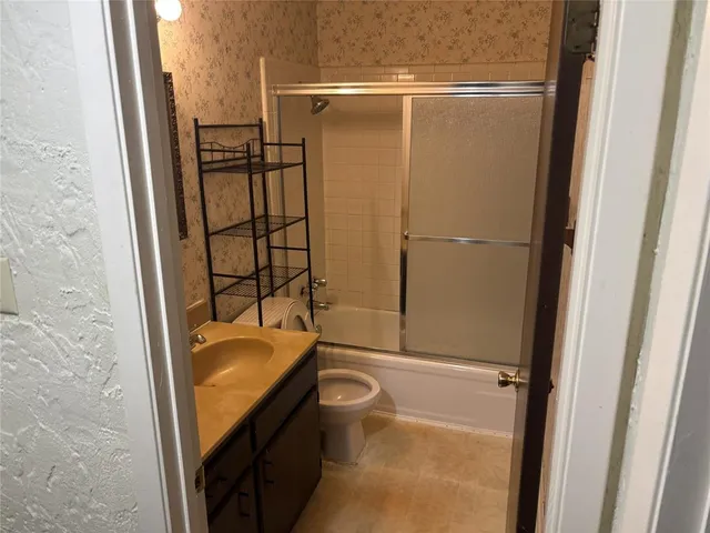 a bathroom with a tub and a shower