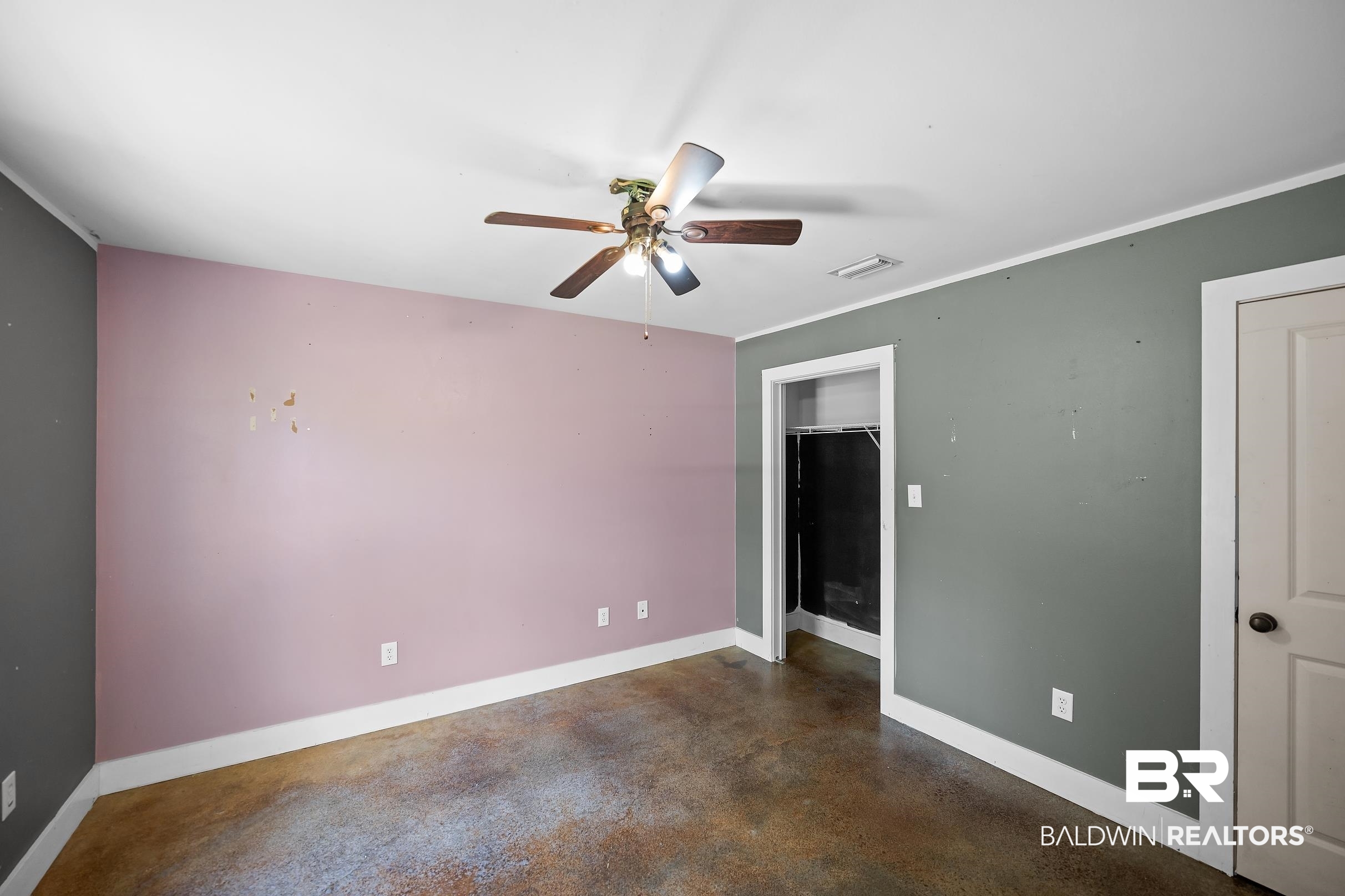 2000 Maria Lane Lillian, AL 36549 - Photo 12 of 35 Unfurnished bedroom featuring finished concrete floors, a closet, and a ceiling fan